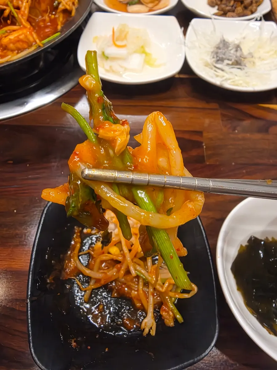 Monkfish meat picked up with chopsticks