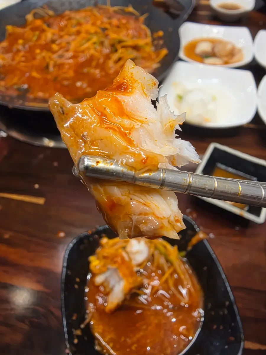 A plate combining bean sprouts and monkfish meat