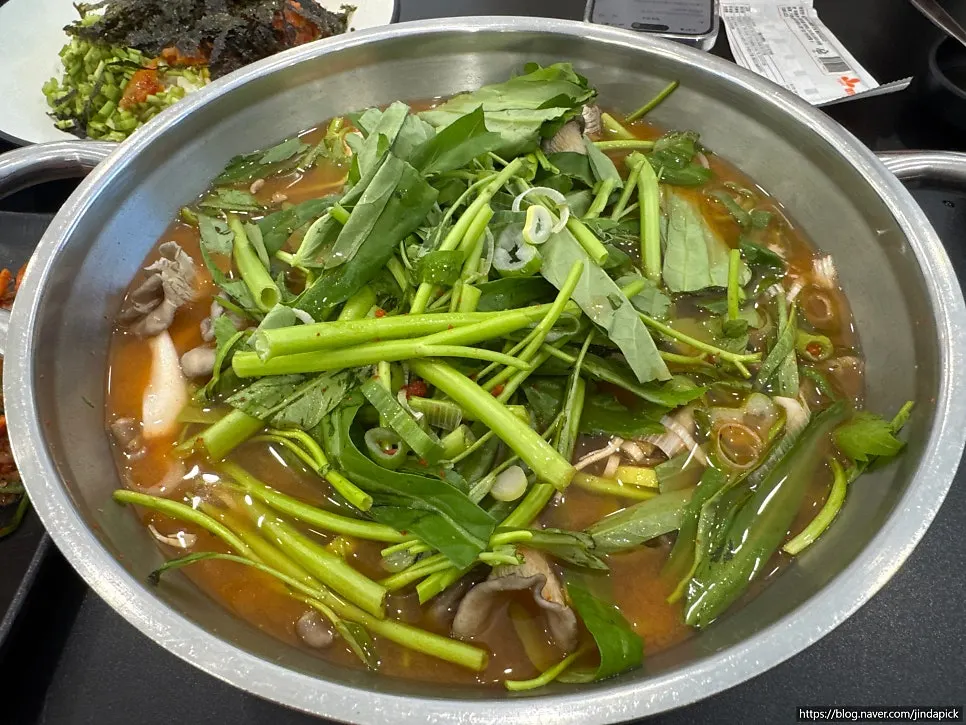 Shabu pot piled high with minari
