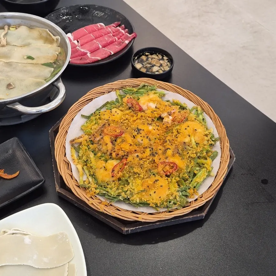 Crispy seafood pajeon topped with king prawns