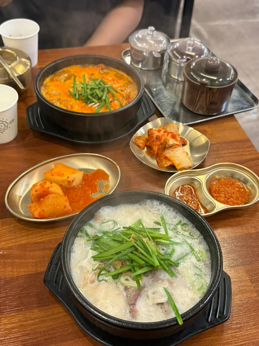 Bubbling stone pot of sundaeguk served at the table