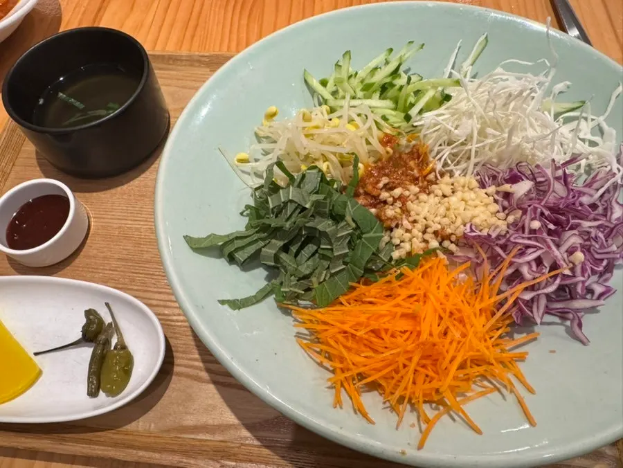 A bowl of Gogi Soboro Bibimbap topped with garnishes