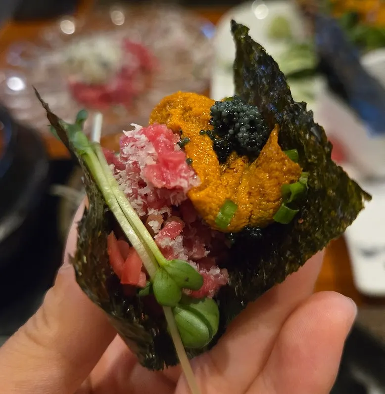 Wrapping hanwoo beef with uni to eat
