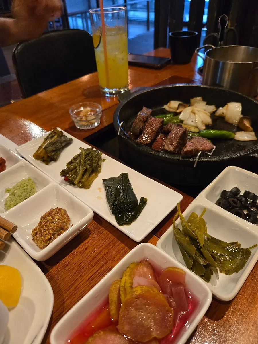 Plate of grilled sirloin with side items