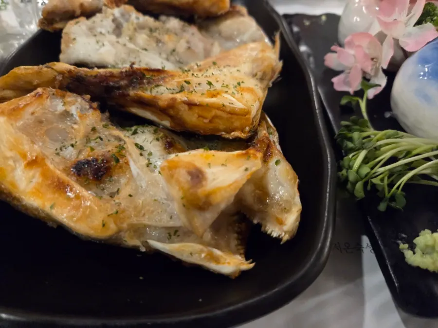 Grilled red sea bream head divided into four portions