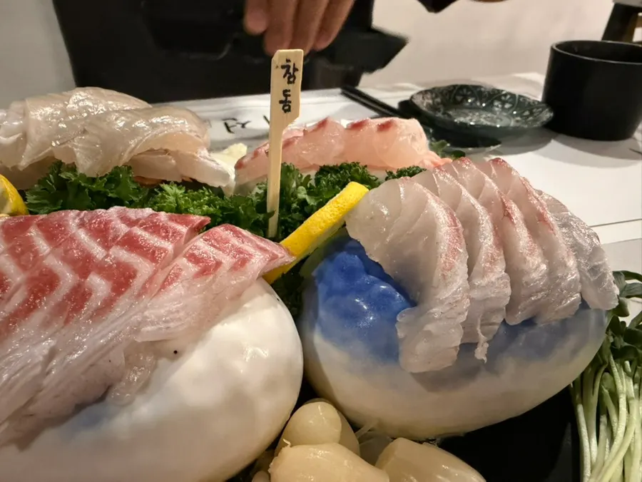 Assorted sashimi with name cards for each fish