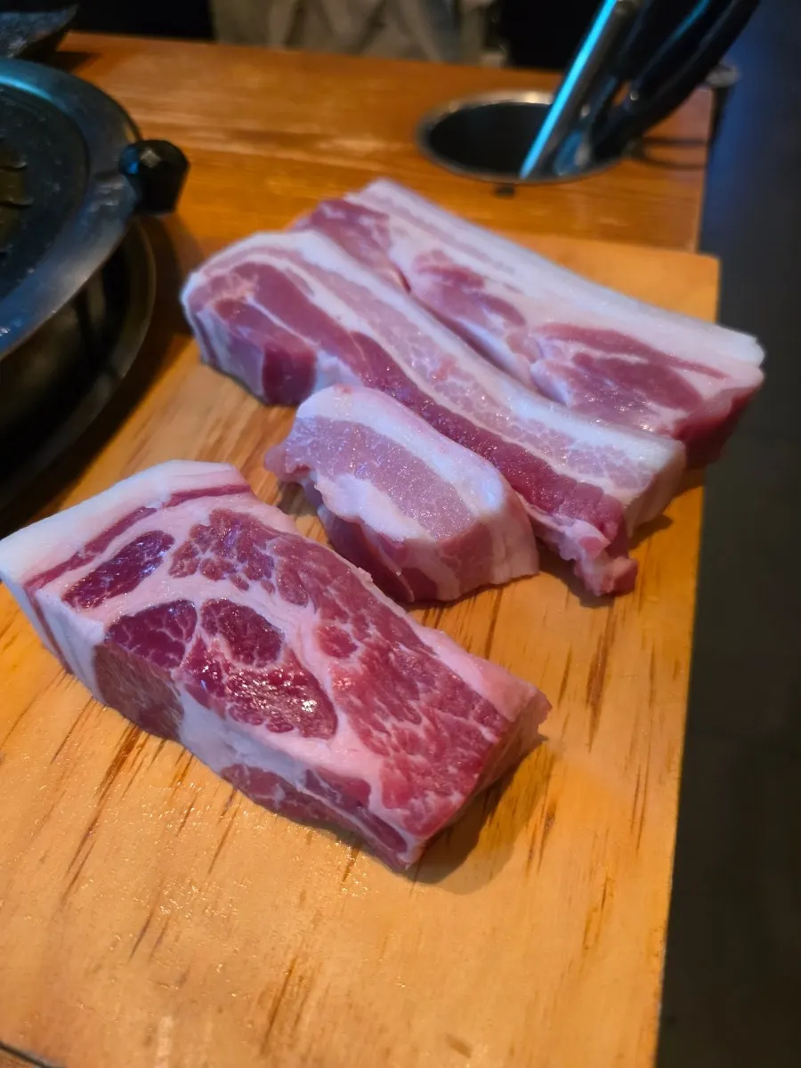 Raw black pork belly and neck from the Jeju Bansang set