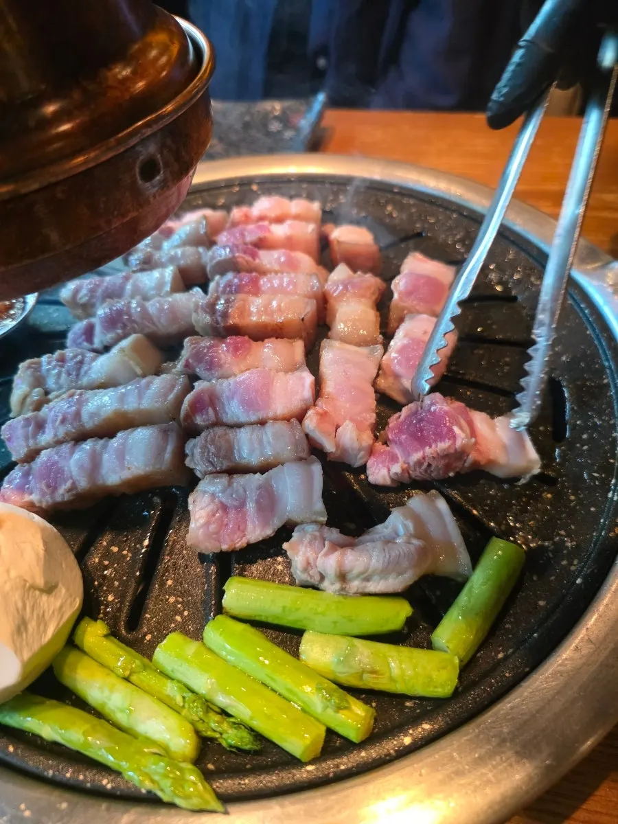 Table with black pork and doenjang jjigae together