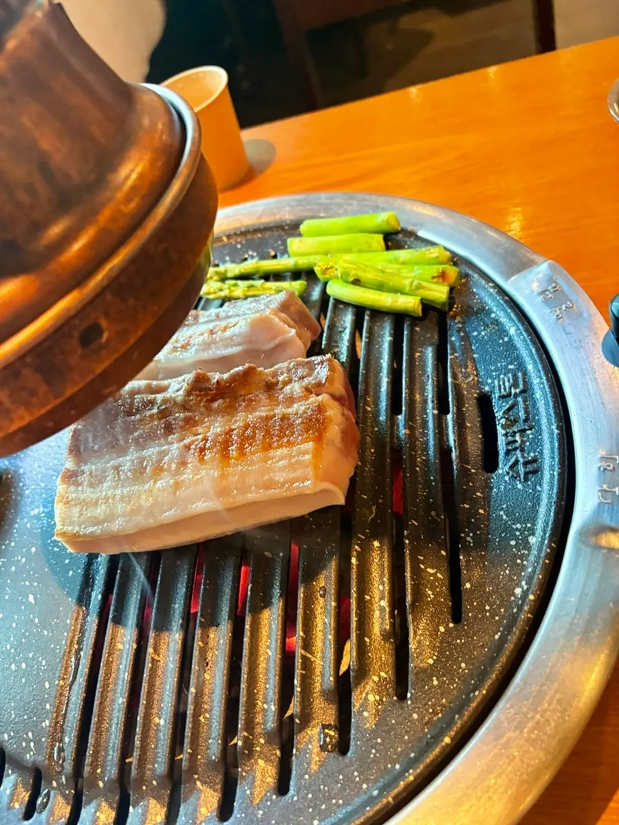 A bite of meat paired with side dishes