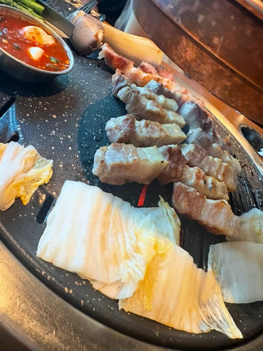 Black pork belly grilled by the staff