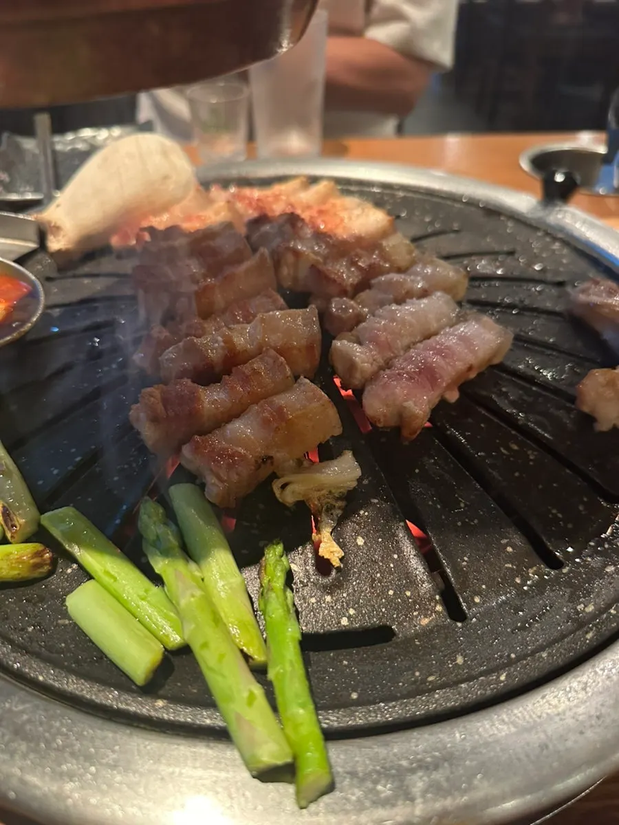Black pork ogyeopsal grilling to golden brown