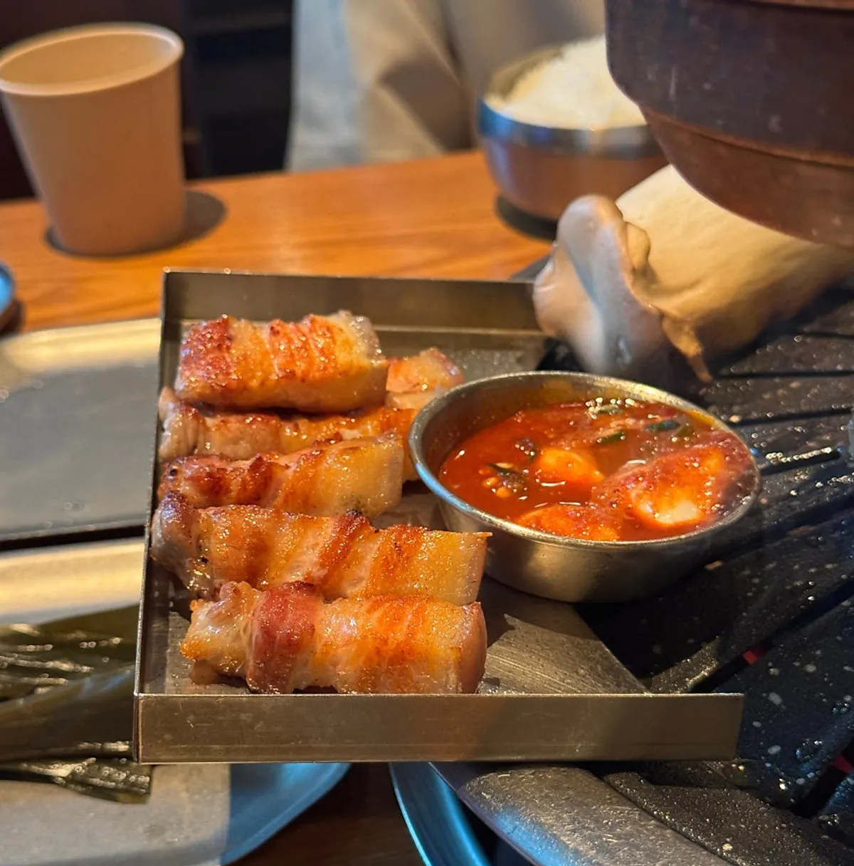 Staff grilling the Jeju black pork belly