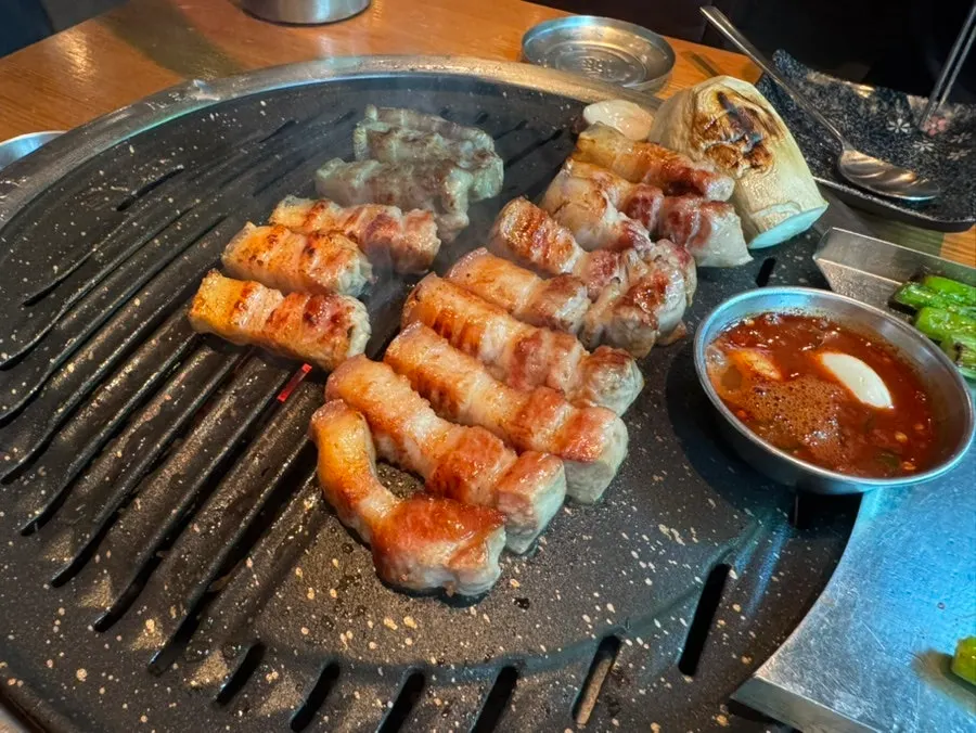 Group meal at a Korean BBQ restaurant near Sunae Station