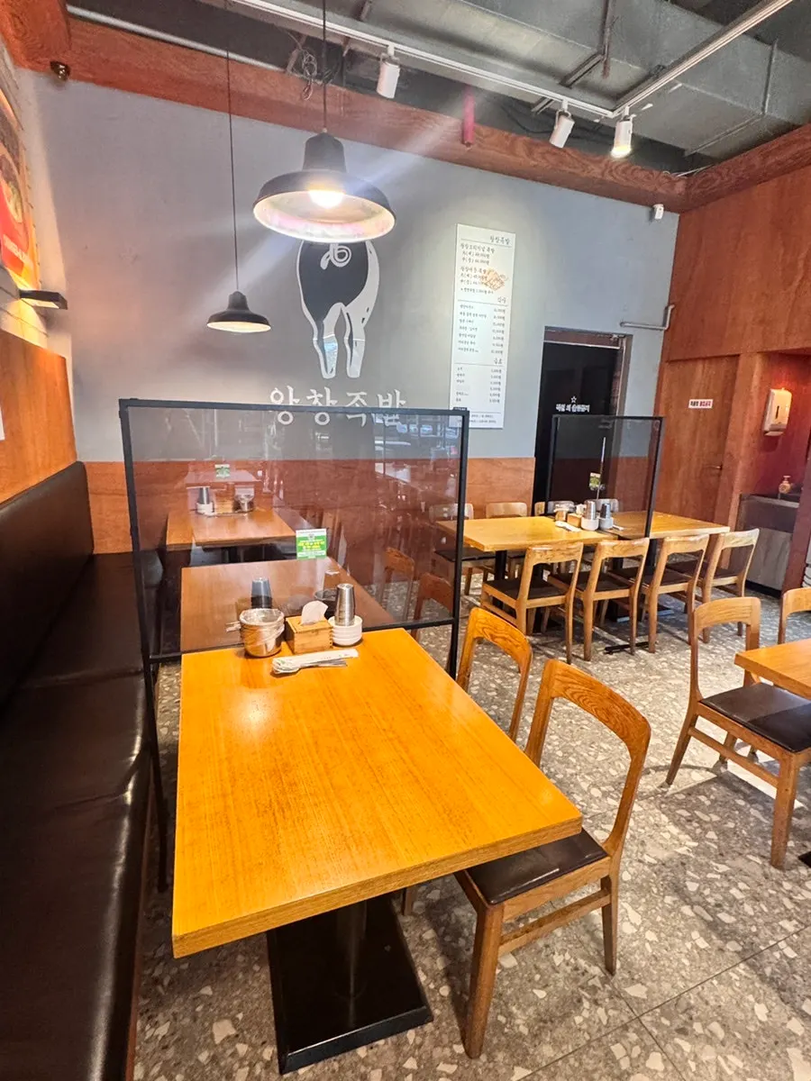 Interior with 4-person tables behind high partitions
