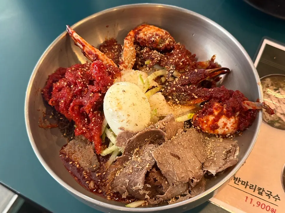 Table spread of naengmyeon, kalguksu, and chicken tenderloin katsu set