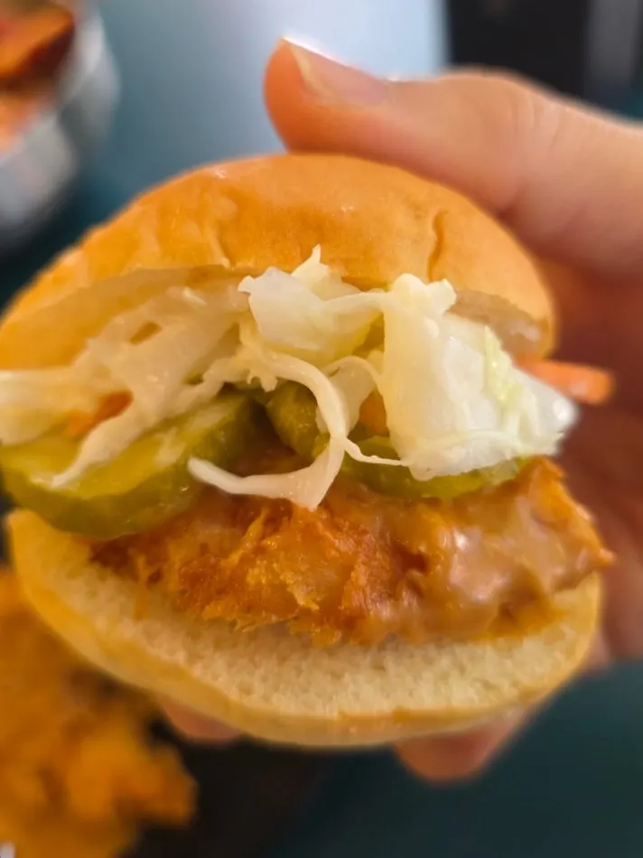 Chicken tenderloin katsu made into a sandwich with dinner rolls