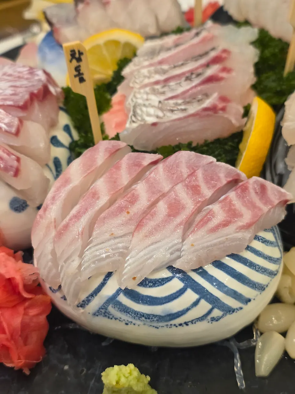 Thick-cut slices of white-fleshed aged sashimi
