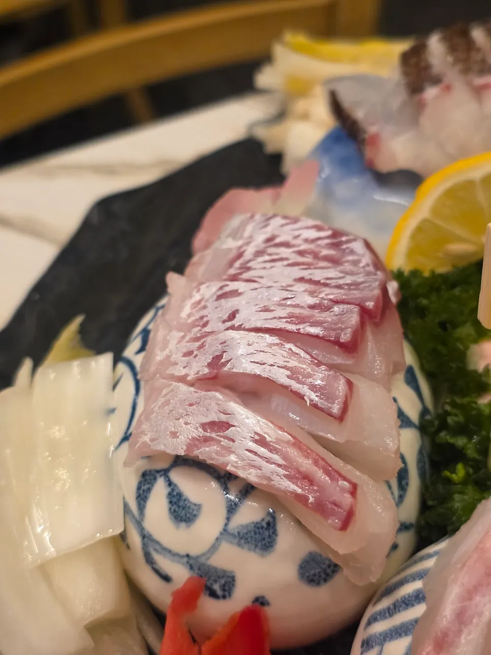 Picking up a piece of aged sashimi