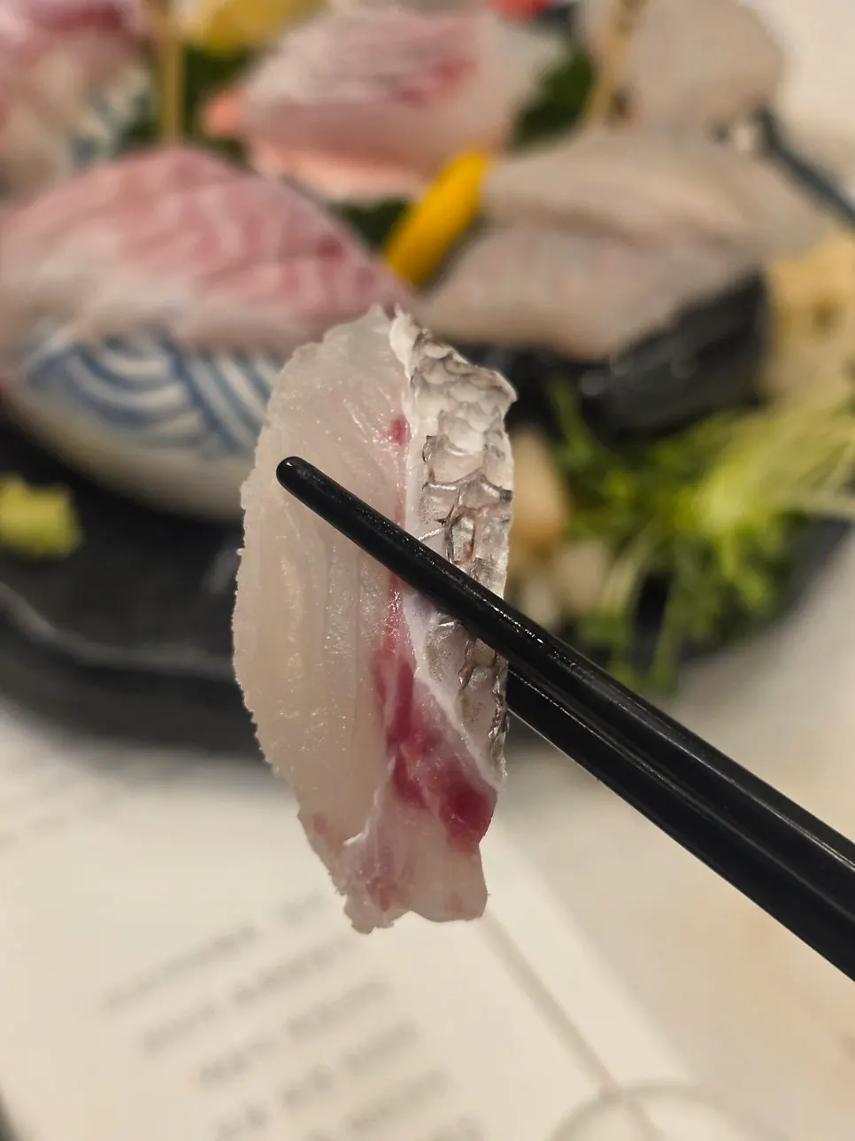 Aged sashimi spread set out alongside drinks