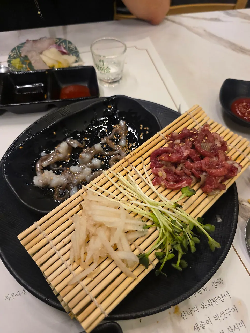 Live octopus and beef tartare eaten together