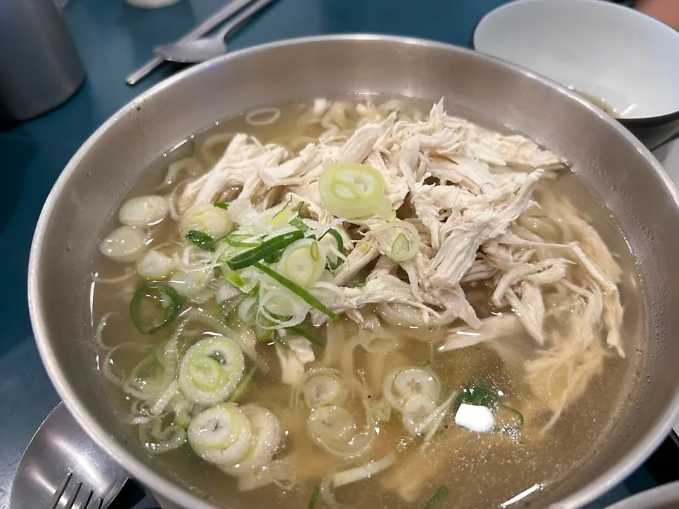 Chicken kalguksu topped with shredded chicken