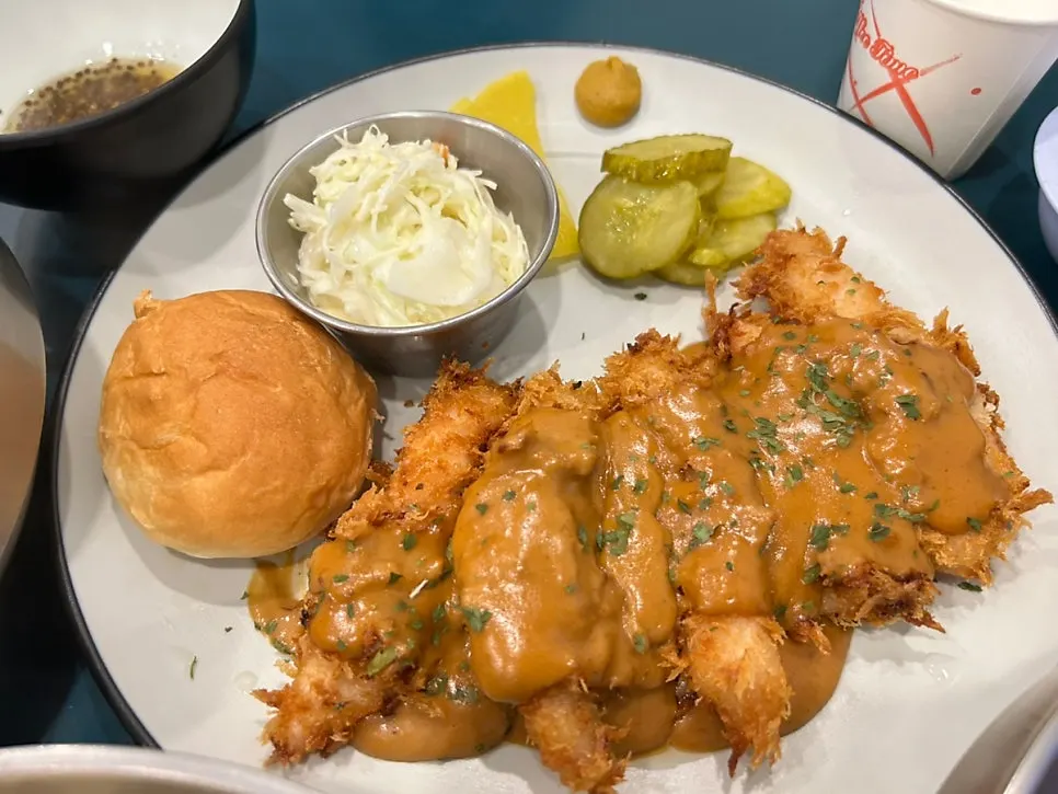 Western-style tenderloin katsu with dinner roll and cabbage salad