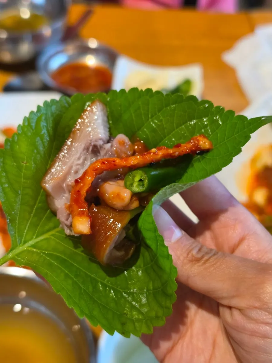 Makguksu topped with jokbal