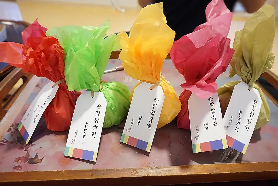 A colorful spread of fresh fruit chapssaltteok