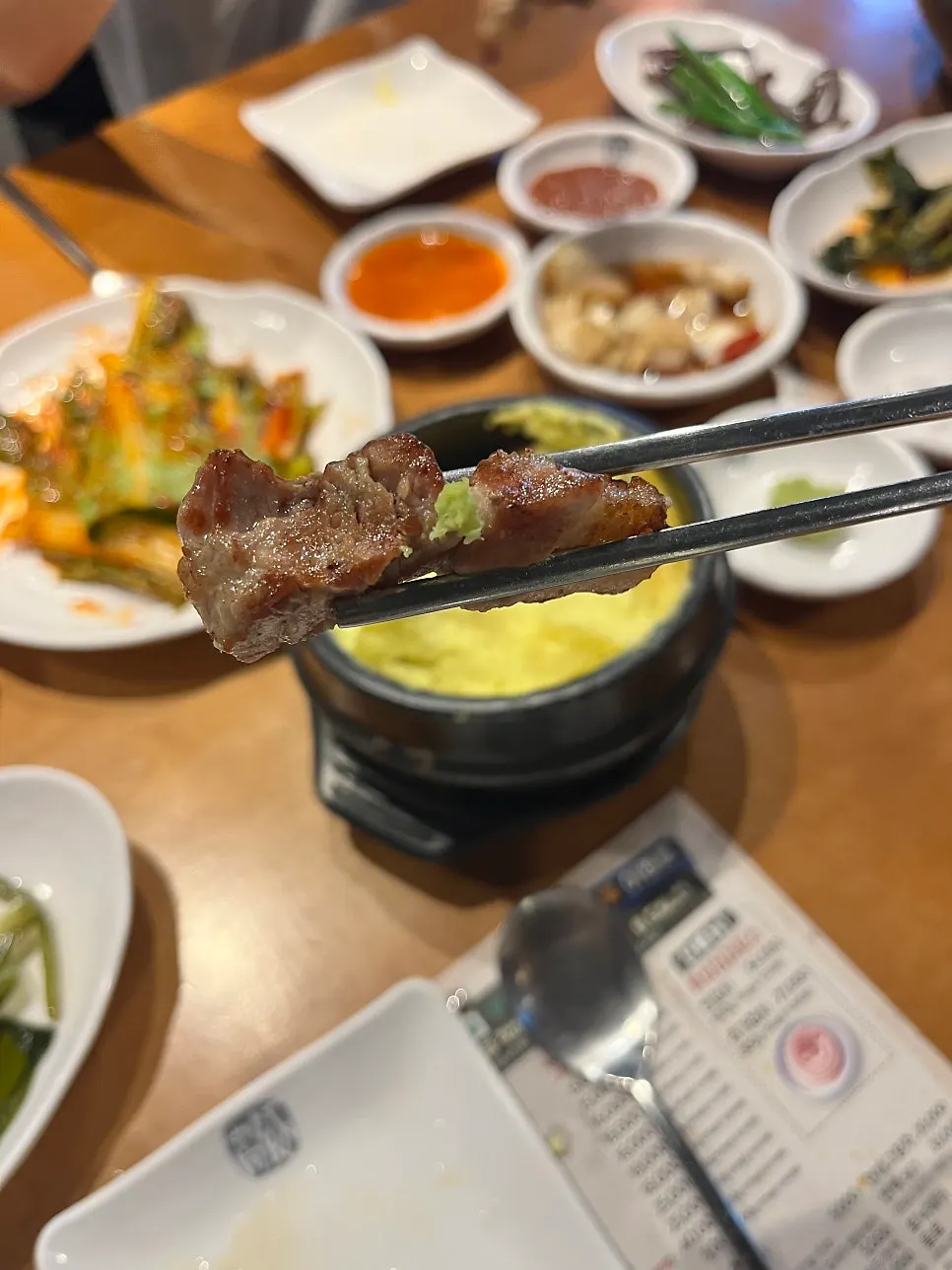 First bite of pork belly dipped only in salt
