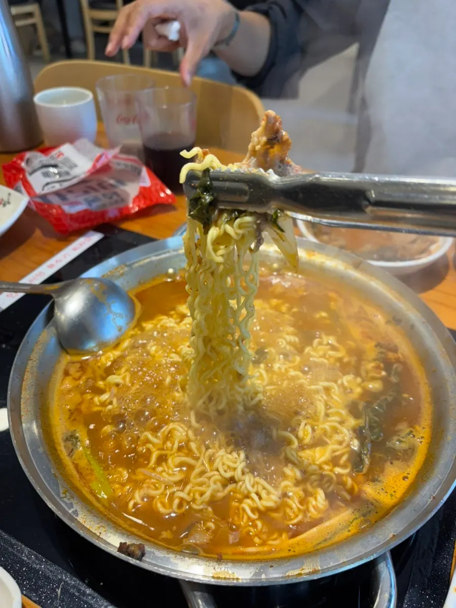 Springy ramen noodles added to the stew broth
