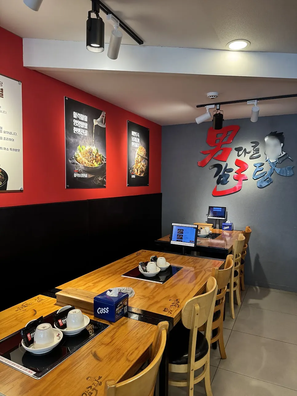Menu board showing hot-plate pork bones and pork bone hot pot