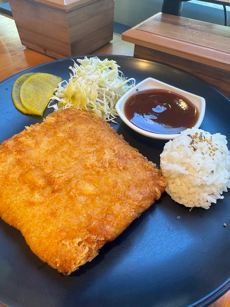 Cheese pork cutlet served with cabbage salad and mini rice