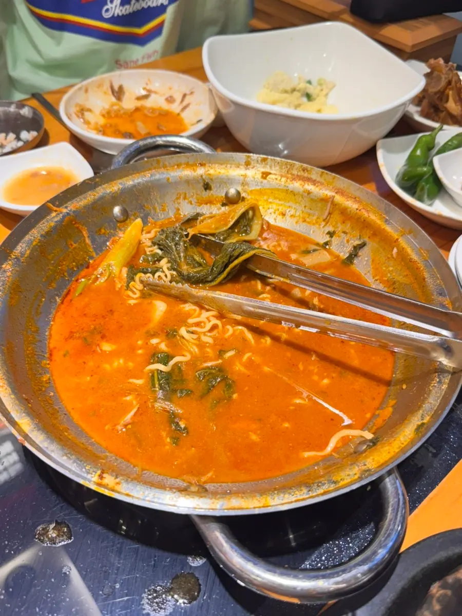 Pork spine with the meat picked off, in broth
