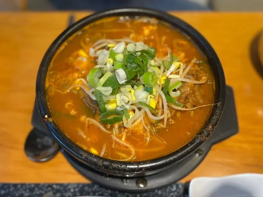 Broth with kimchi and tofu inside