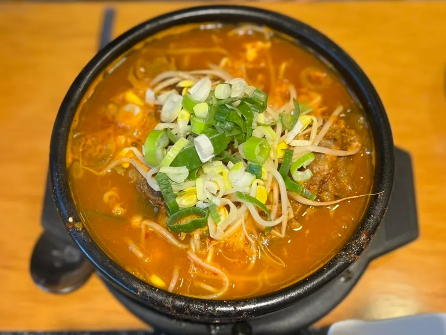 Close-up of tofu kimchi haejangguk broth