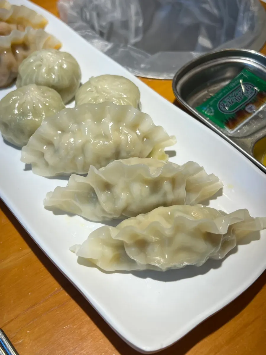Table spread with dumplings and haejangguk together
