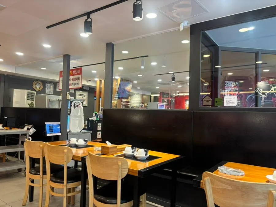 View of table seating inside Namdareun Gamjatang
