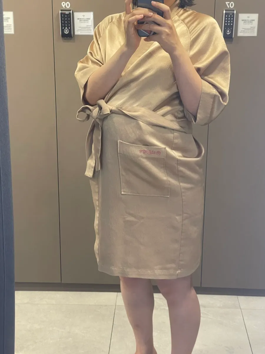 Changed into a treatment gown, ready for the prenatal massage