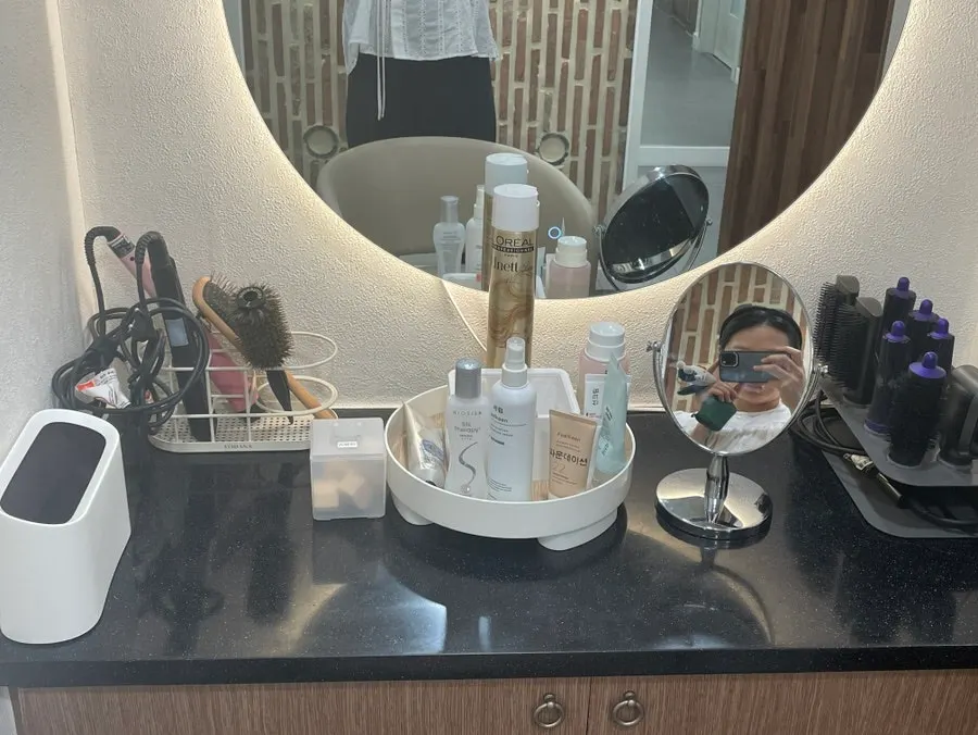 Hair dryer and cosmetics in the powder room after care