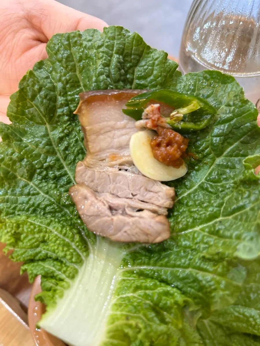 Small dombe pork served with salted shrimp and lettuce wraps