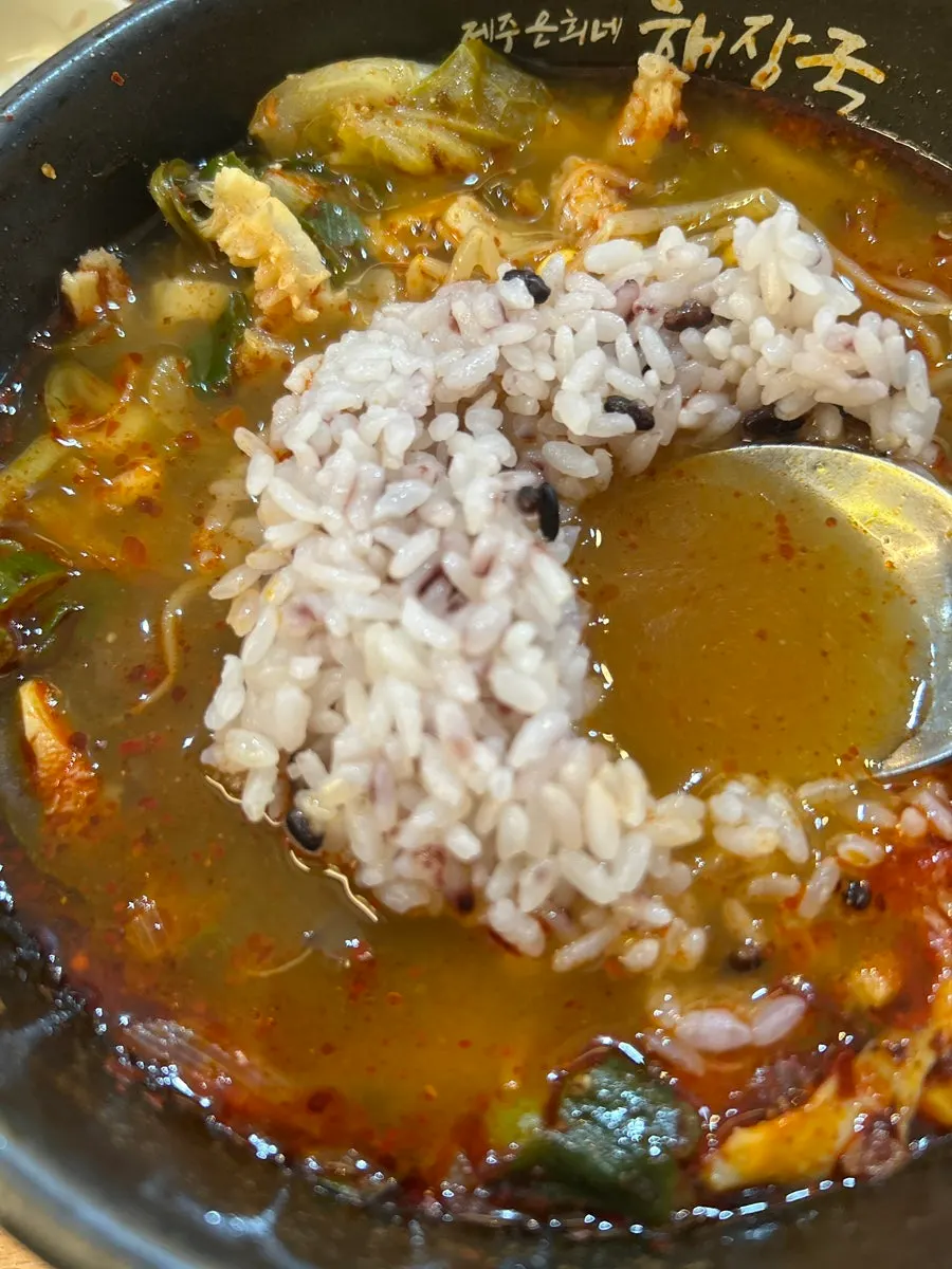 A piece of tripe dipped in seasoning sauce
