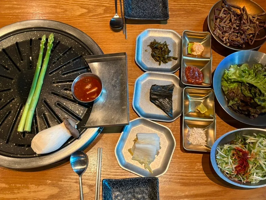 Banchan spread set out after ordering the meat