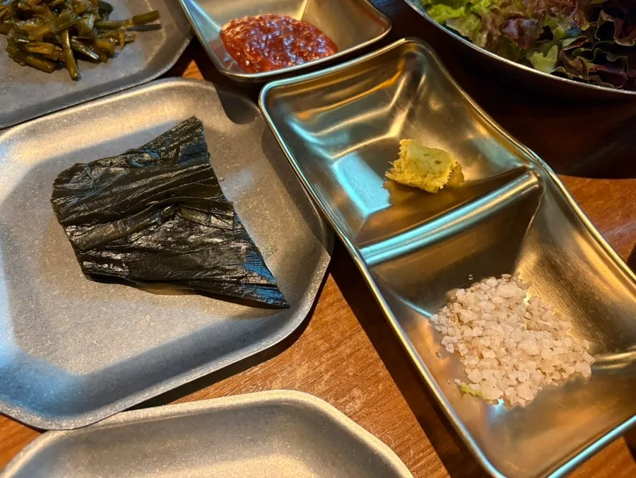 Salt, wasabi, and wild garlic leaves side dishes