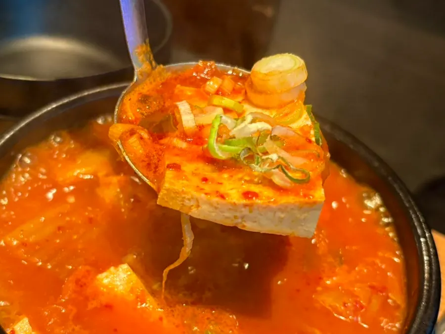 Chunks of meat inside the kimchi jjigae