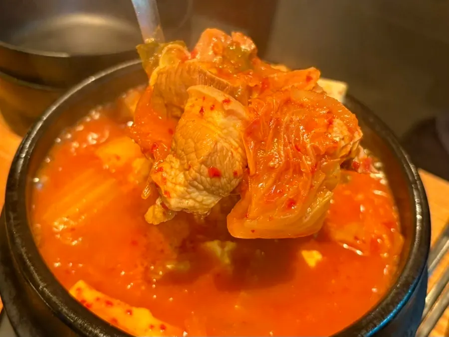 Kimchi jjigae served alongside the meat spread
