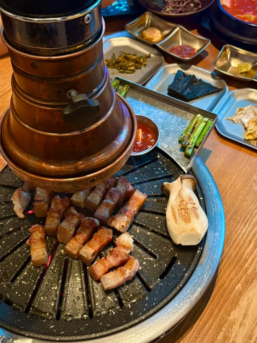 Thick-cut black pork belly showing its thickness