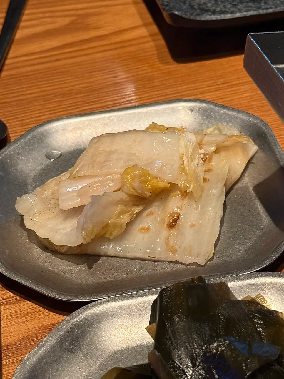 Grilled baek kimchi moved back to the table after grilling