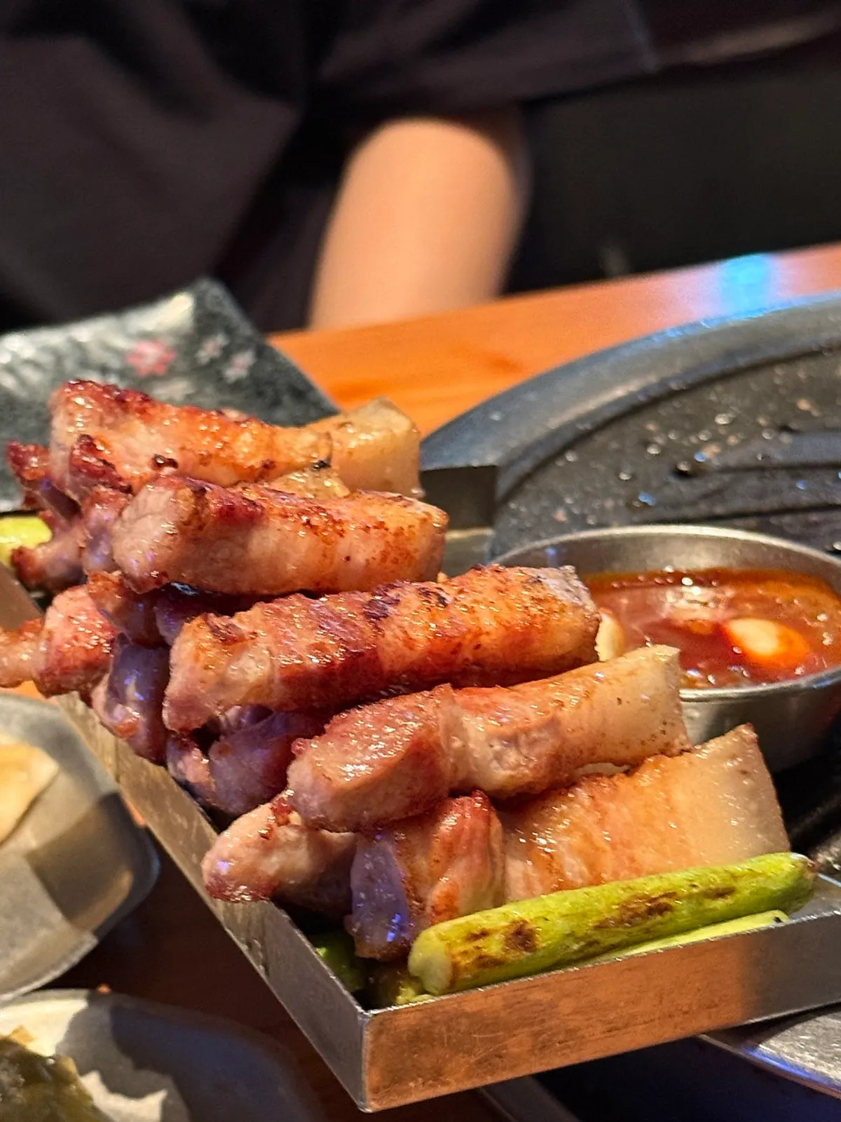 Black pork samgyeopsal grilled neatly in rows