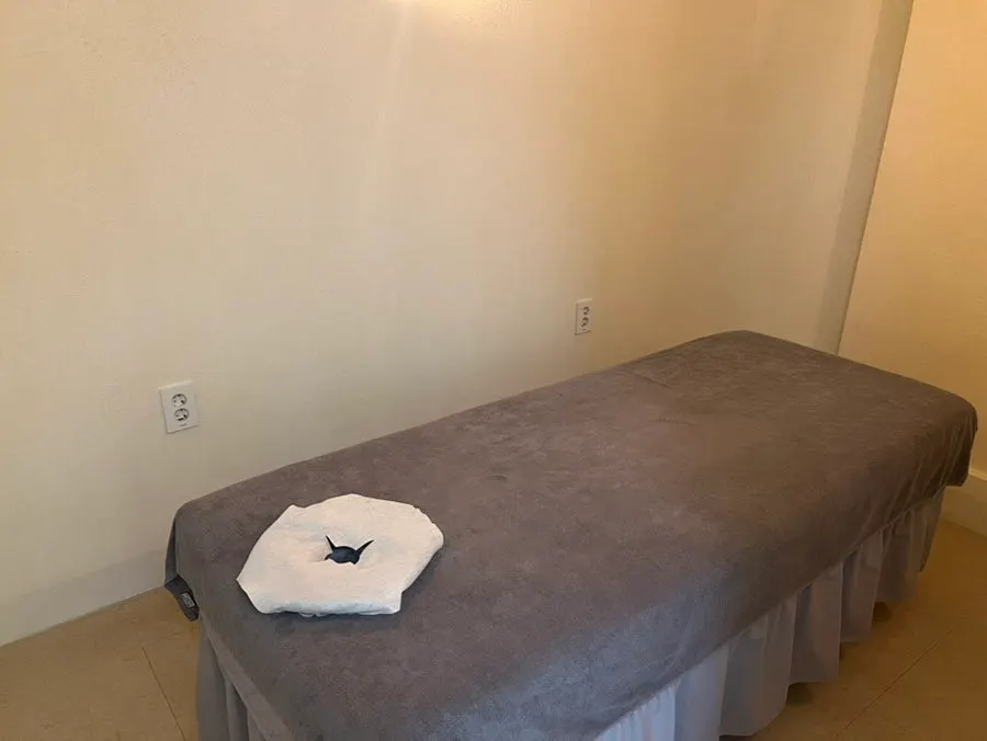 Bed and lighting in the private treatment room
