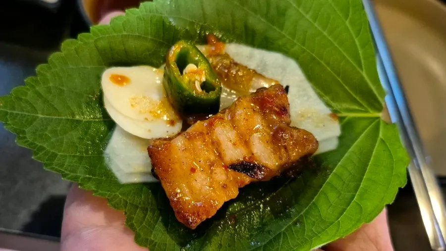 Pork belly wrap with perilla leaf and pickled radish